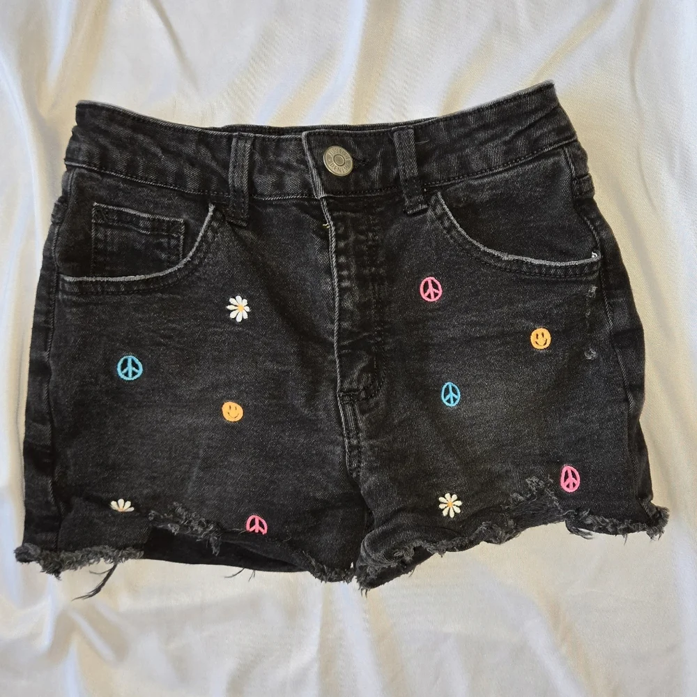 Justice Black Cut Off Denim Shorts with Embroidered Peace, Smiley Face And Daisy